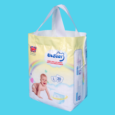 El bebé blanco del ADL levanta los pantalones que la absorbencia estupenda orgánica levanta los pañales impresos